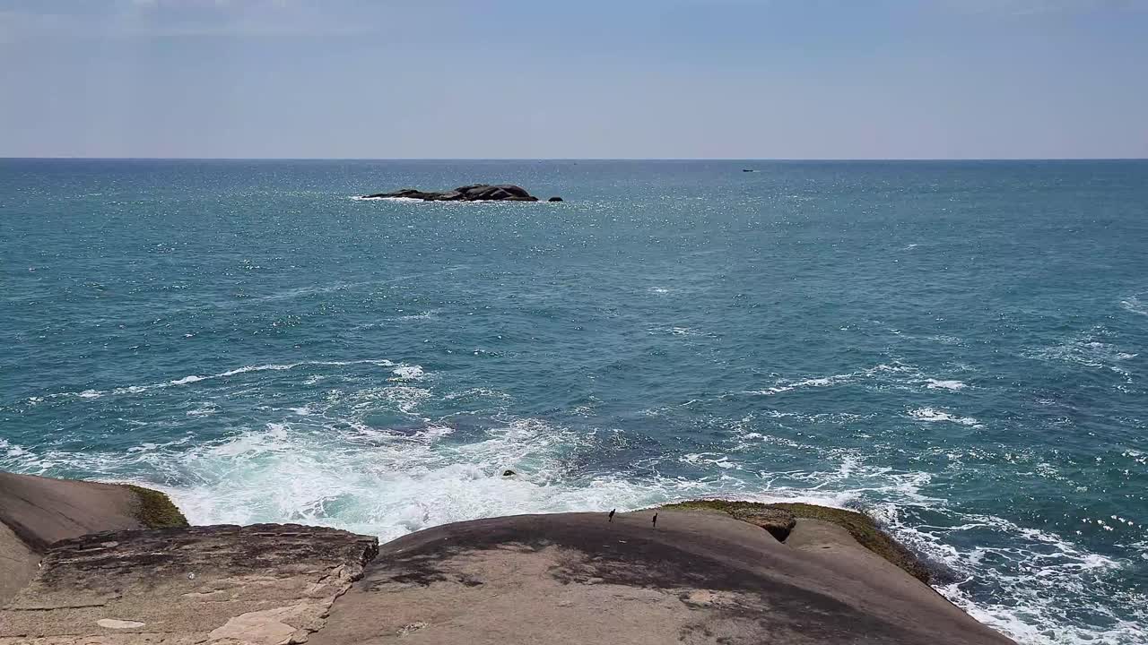 Waves moving with blue ocean at tip of South India, Kanniyakumari