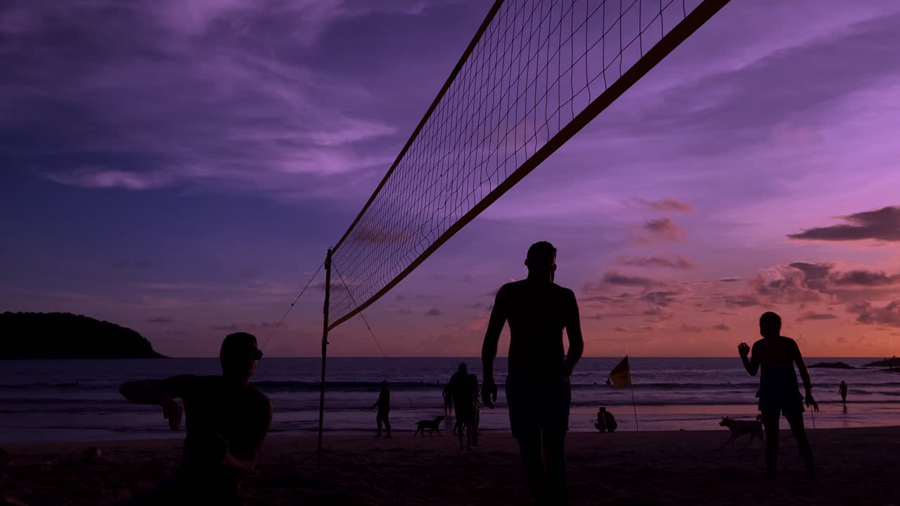 Beach volleyball at sunset