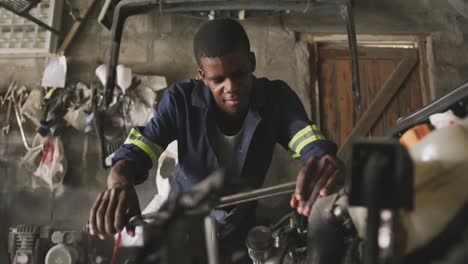 african man repairing car