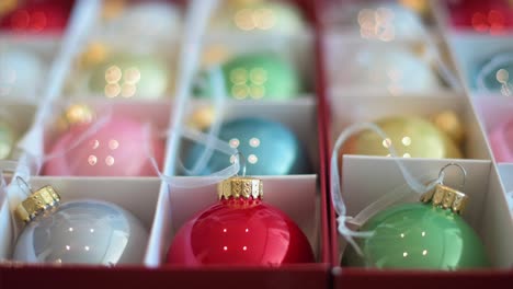 sharp focus on colorful tree decorations organized in a box