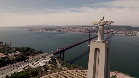 drone flying pass holy sanctuary of christ the king reveals beautiful tagus river between almada and lisbon