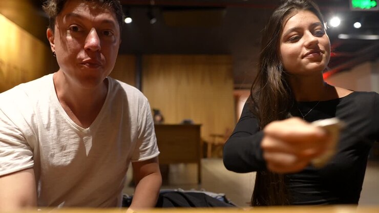 Two people talking in a cafe