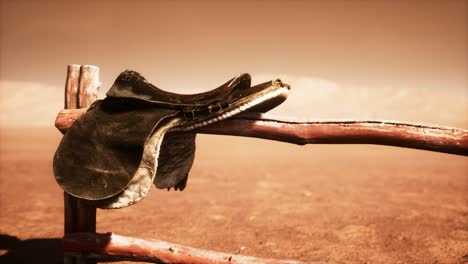 horse saddle on the fence in monument valley