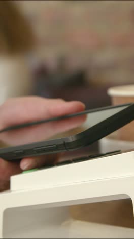 close up of contactless phone payment 03