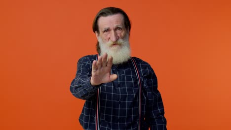 Elderly-bearded-gray-haired-man-say-no-stop-gesture,-warning-of-finish,-prohibited-access,-declining