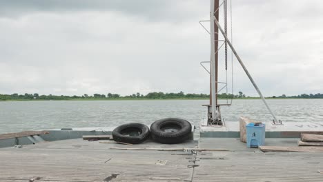 cloudy day travel by barge on calm river afram ghana