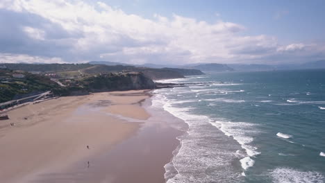 drone view of the waves of sopelana beach in basque country