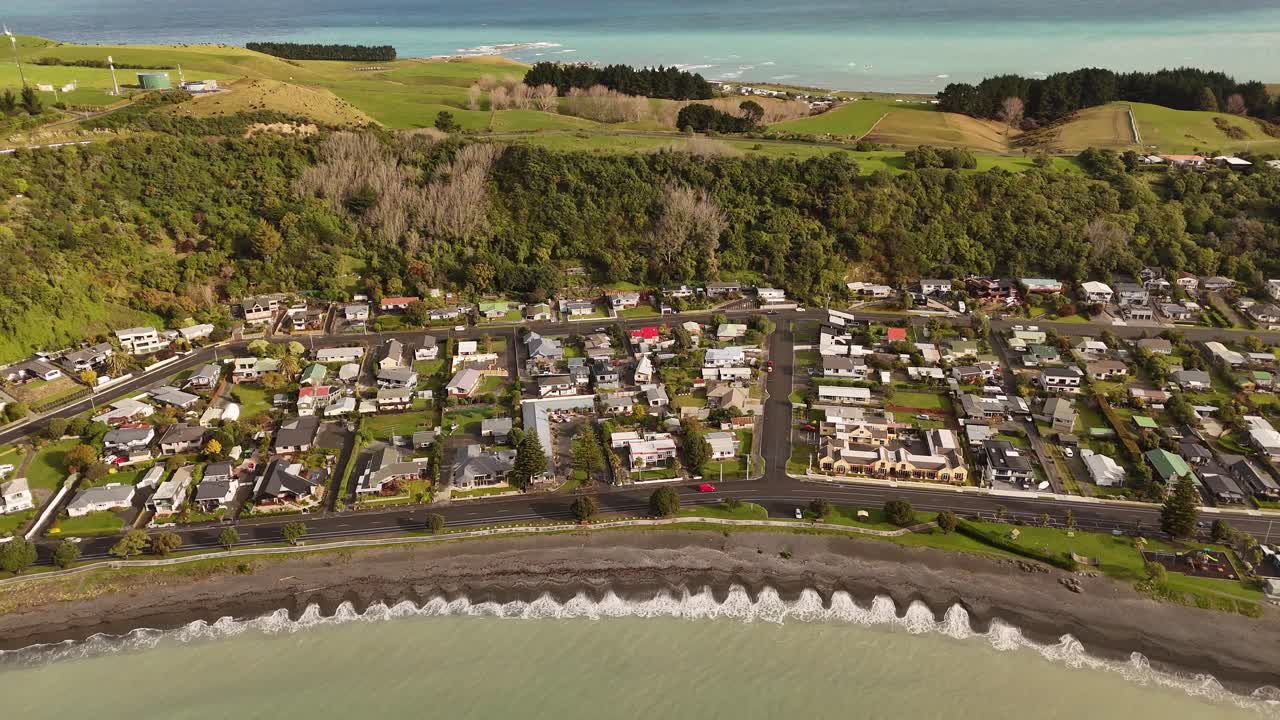 Breathtaking 4K drone footage captures a dramatic tilt-down shot over the Kaikoura Area in New Zealand's South Island, revealing the rugged coastline and stunning ocean views from the sky