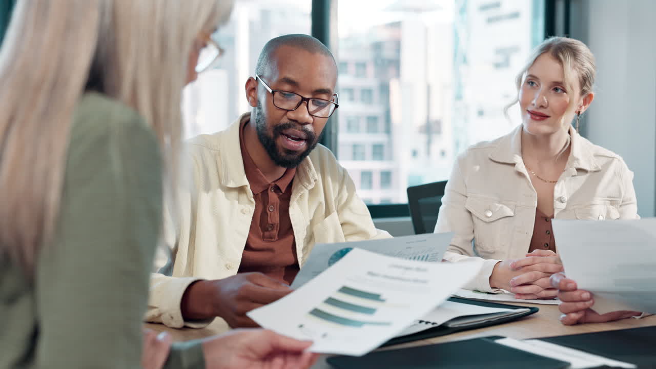 Business Team Discussing Charts and Data