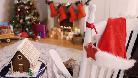 santa hat and christmas decoration hanging on chair