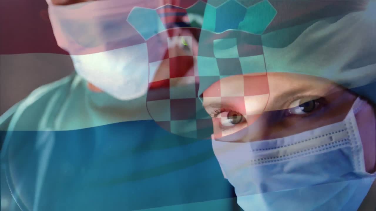 Animation of flag of croatia waving over surgeon in operating theatre