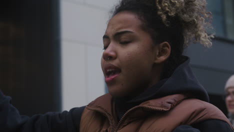 Close-Up-Of-An-American-Female-Activist-Protesting-Against-Climate-Change