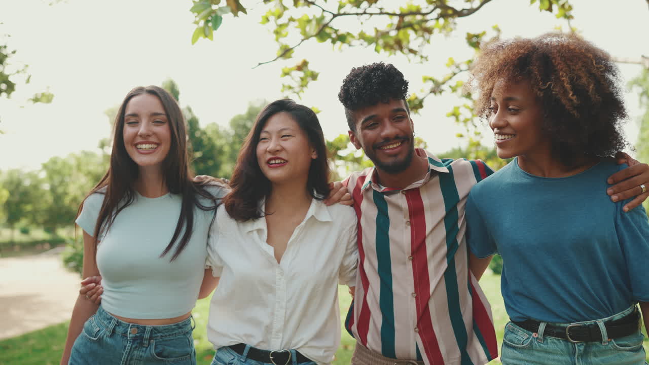 Group of diverse friends laughing and enjoying time together in a park
