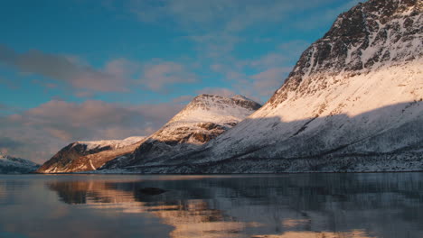 stunning low level tracking shot on the edge of a fjord, norway