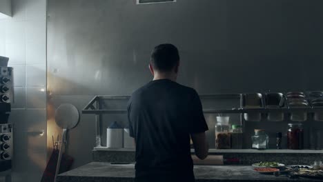 anonymous chef stretching dough for pastry