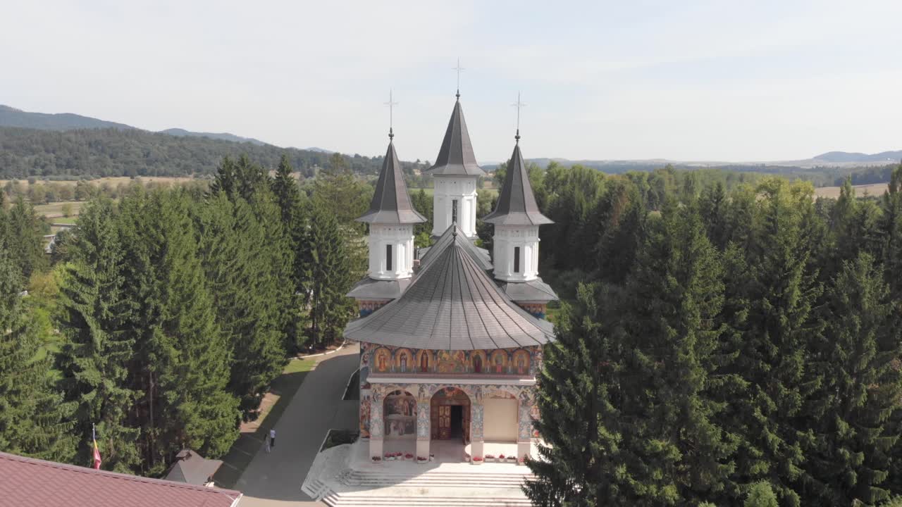 Monastery of St John Jacob Chozebite, Neamt, Romania. Christian Orthodox Church. Aerial Filming. Flying towards