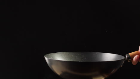 chef cooking in a wok
