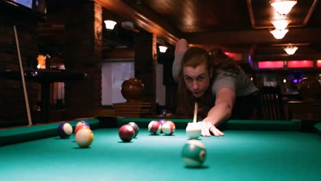 man playing snooker in night club 4k