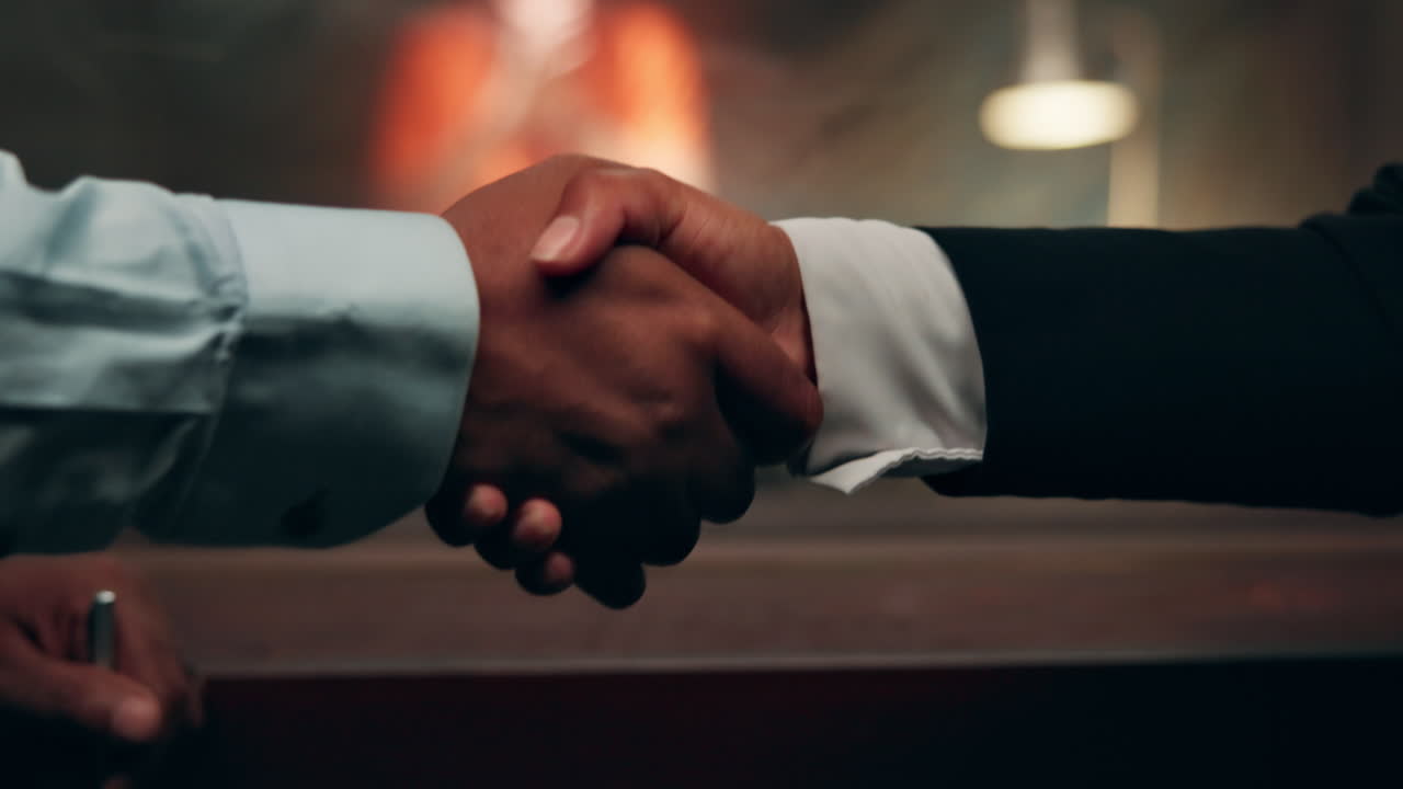 Handshake between two men in a professional setting