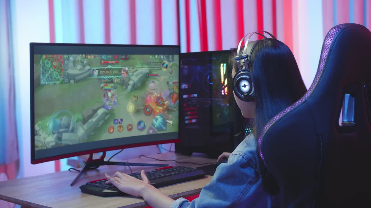 Asian Girl Gamer Playing Online Video Game