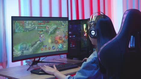 Asian Girl Gamer Playing Online Video Game