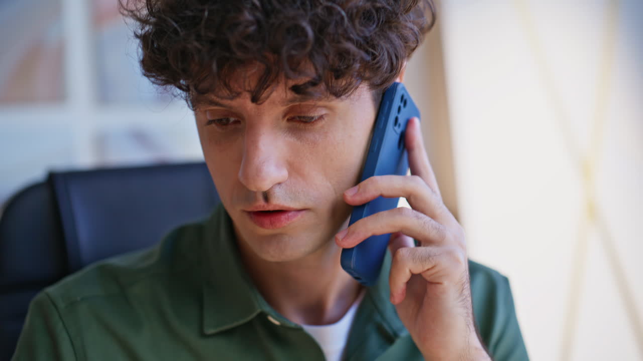 Portrait company employee calling cellphone discussing work issues. Man talking