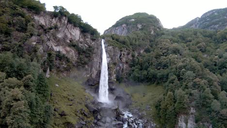 FPV-aerial-drone-shot-of-waterfall-near-town-of-Foroglio,-Ticino,-Switzerland