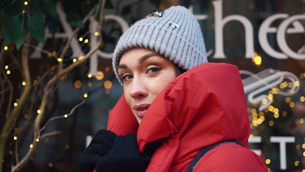 Woman in Red Coat and Hat in Winter