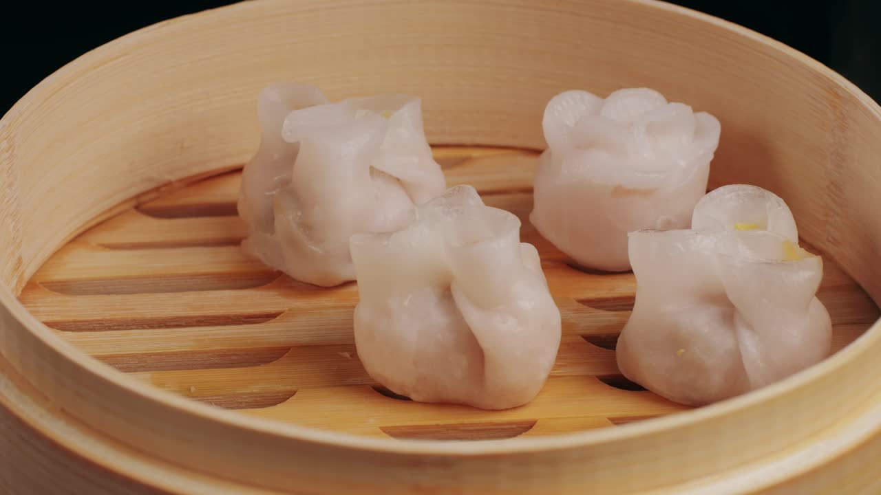 Various of dim sum on wooden steamer close-up macro. Steaming Technique. Chinese dessert food. Dimsum with shrimps, fish and meat. Dish in a cafe. Homade. Delivery
