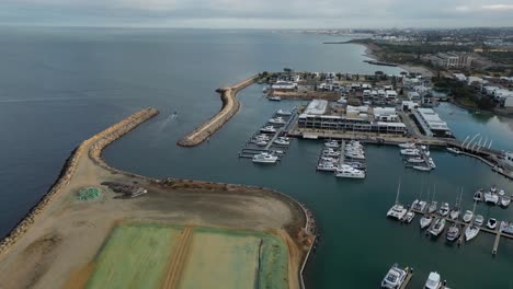 flying over lot of boats side by side anchored at coogee port, perth city