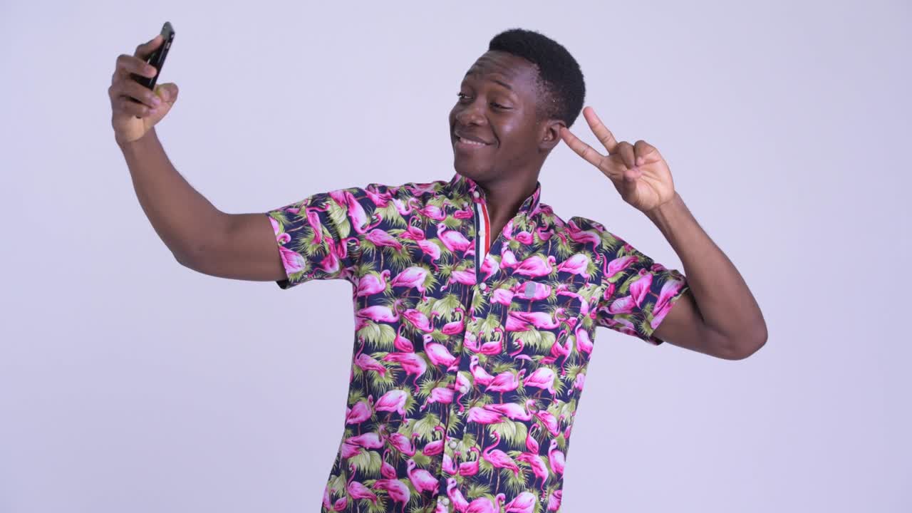 Young handsome African tourist man