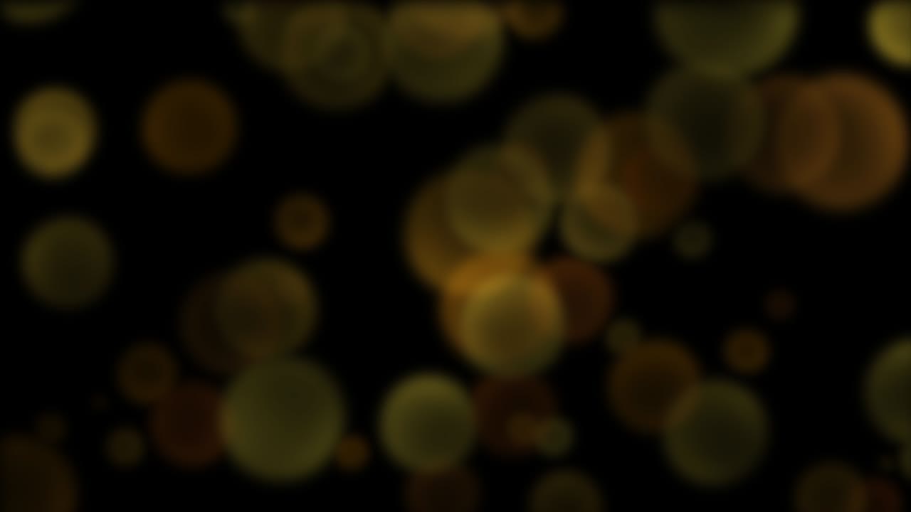 volar gran oro redondo bokeh en el fondo oscuro