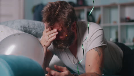man exhausted after a party