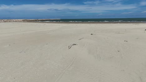 aerial view dolly of walking on the secret beach in vung tau