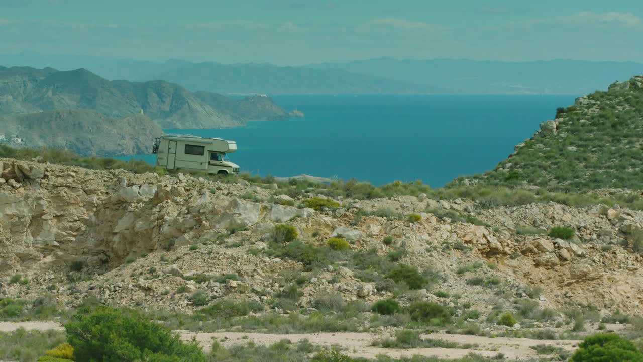 Stunning shot of an old campervan descending a hill in Spain