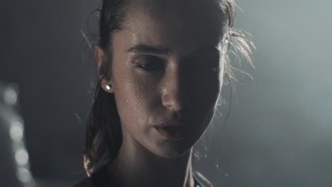 close-up of a sweaty woman after intense workout