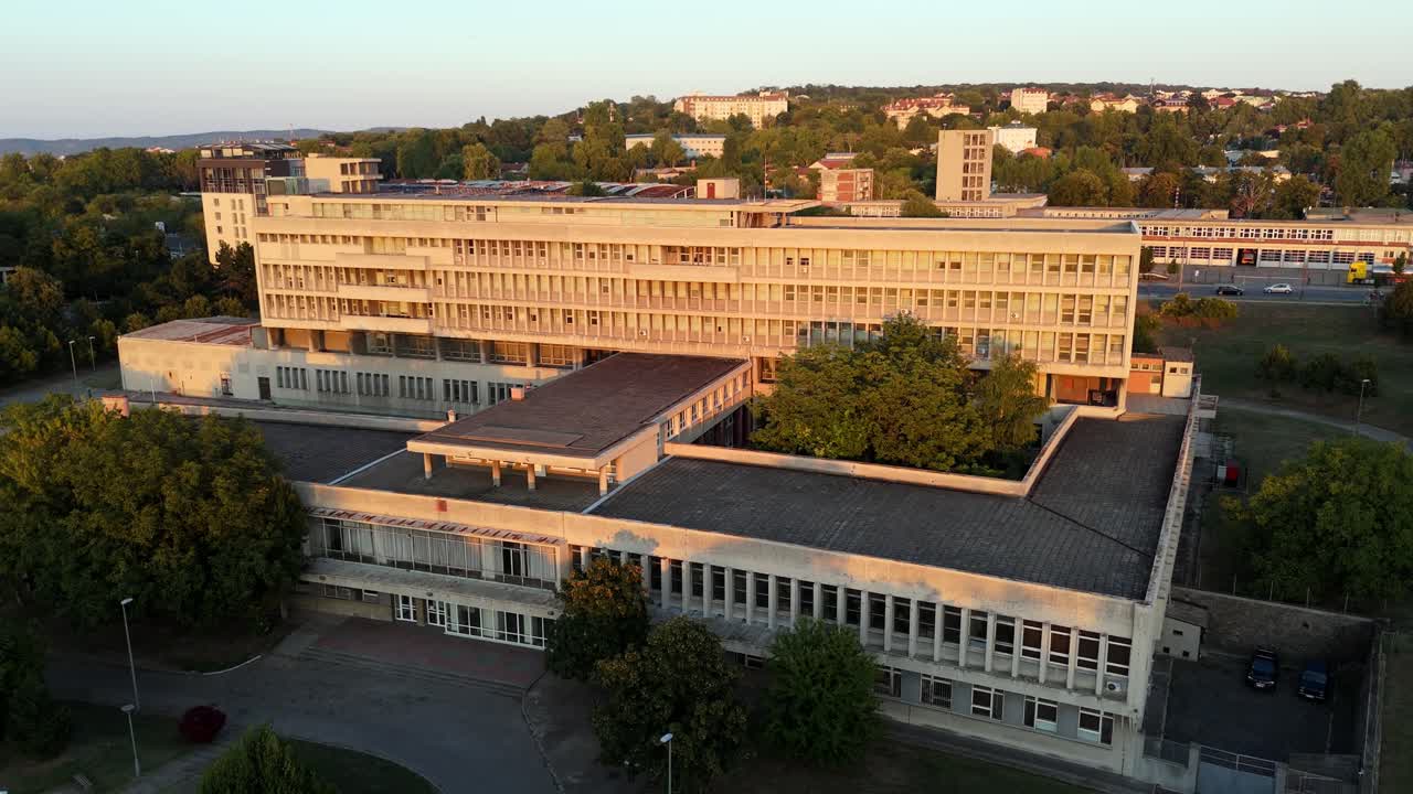 Aerial drone view of Belgrade’s brutalist residential buildings at sunset, in Serbia European capital city