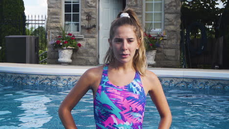 swimmer breathing deeply in a swimming pool