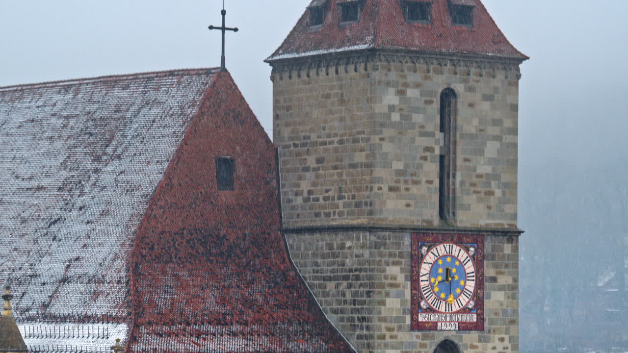 Close up of the Black Church in Brasov in south-eastern Transylvania, Romania while snowing