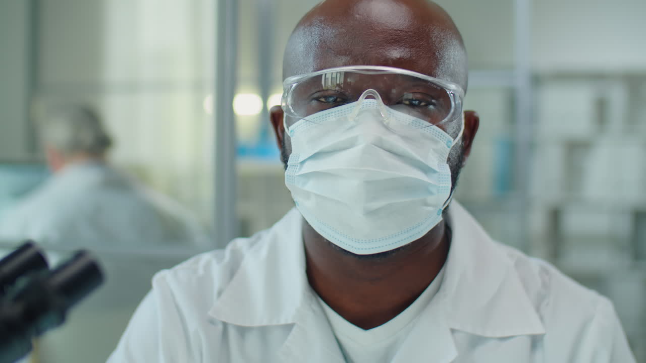 Portrait of African American Scientist in Mask and Glasses in Lab
