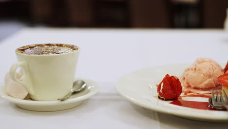 Delicious-homemade-dessert-of-Meringue,-chantilly-cream-and-ice-cream-with-cappuccino