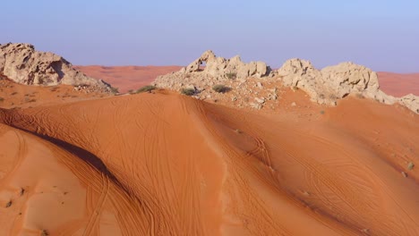 4k drone footage, aerial view of fossil rocks plateau in mleiha desert with sand ripples, geological landscape of the sphinx in sand dunes desert in the united arab emirates, drone videos