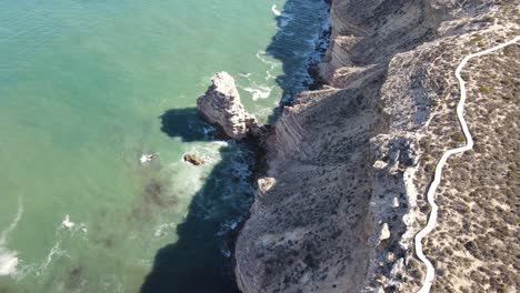 drone aerial pan up over castle rock in kalbarri