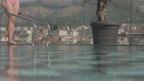 a beautiful view of the girl entering the pool