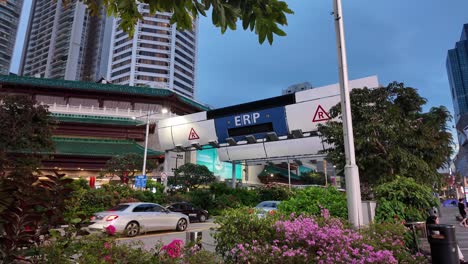 city street scene with erp toll plaza at twilight