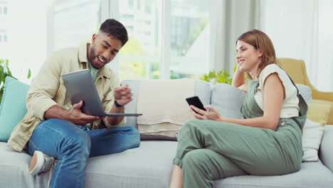 Laptop,-conversation-and-couple-on-sofa-relax