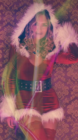 woman dances in cute santa claus costume for christmas time disco shoot in vertical