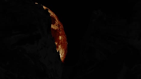 siluetas de la roca con la luna gigante