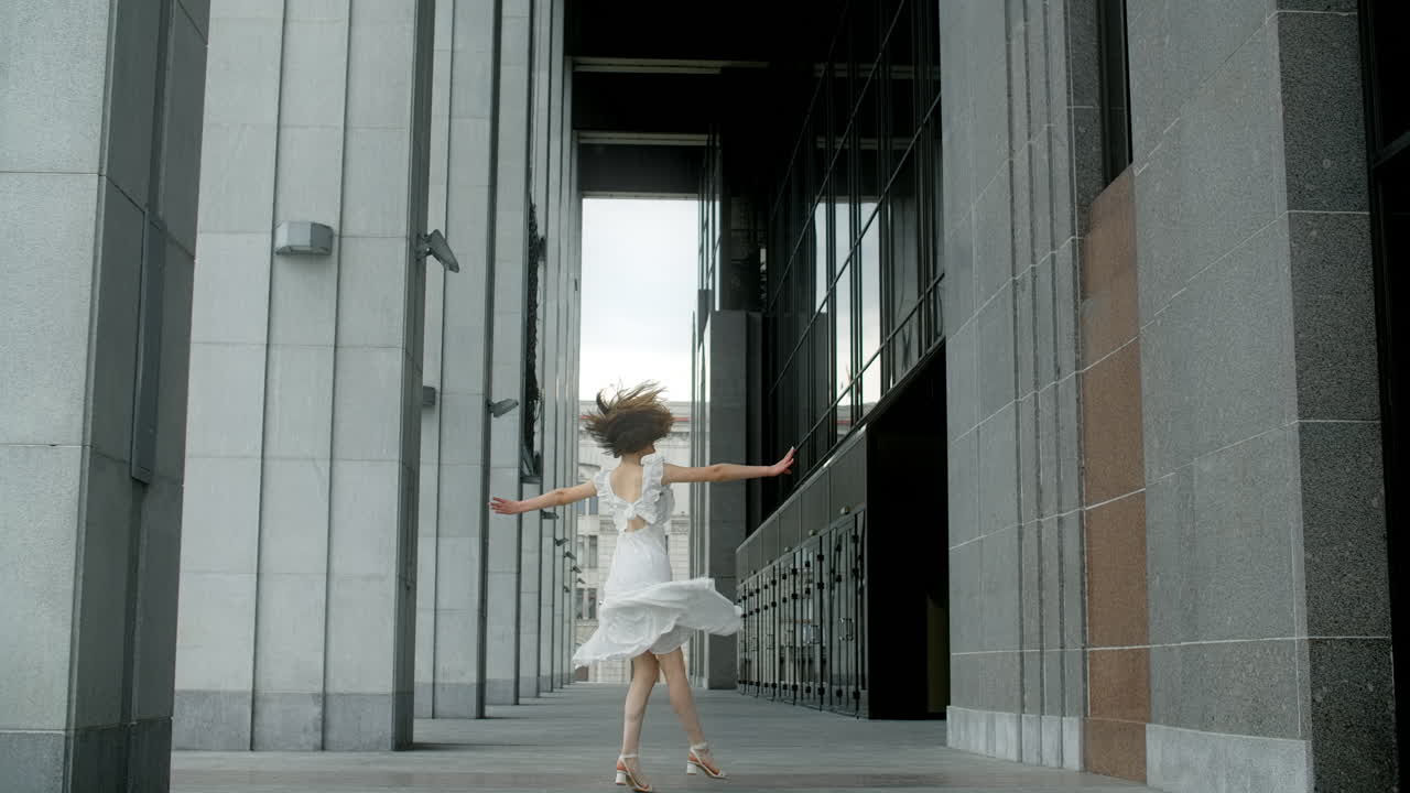 Woman Running in a City Building