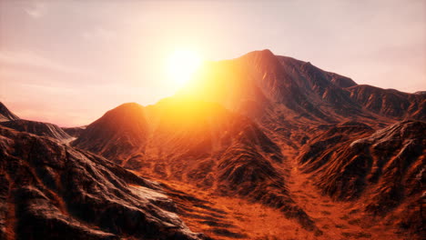 sun rays over mountains in a valley